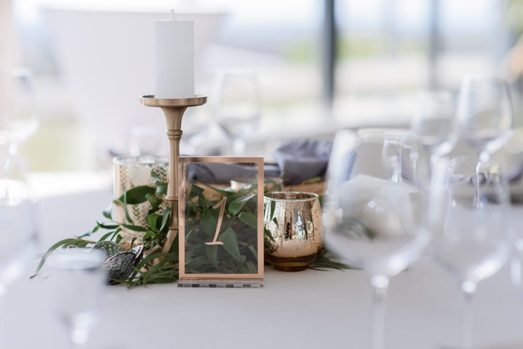 Close up view of a table set for a wedding.